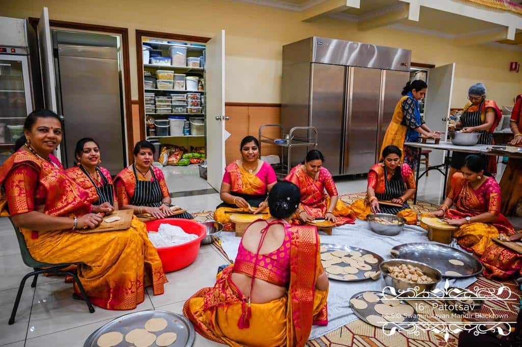 Kinjal Soni preparing festive meals in the temple with other community members. 
