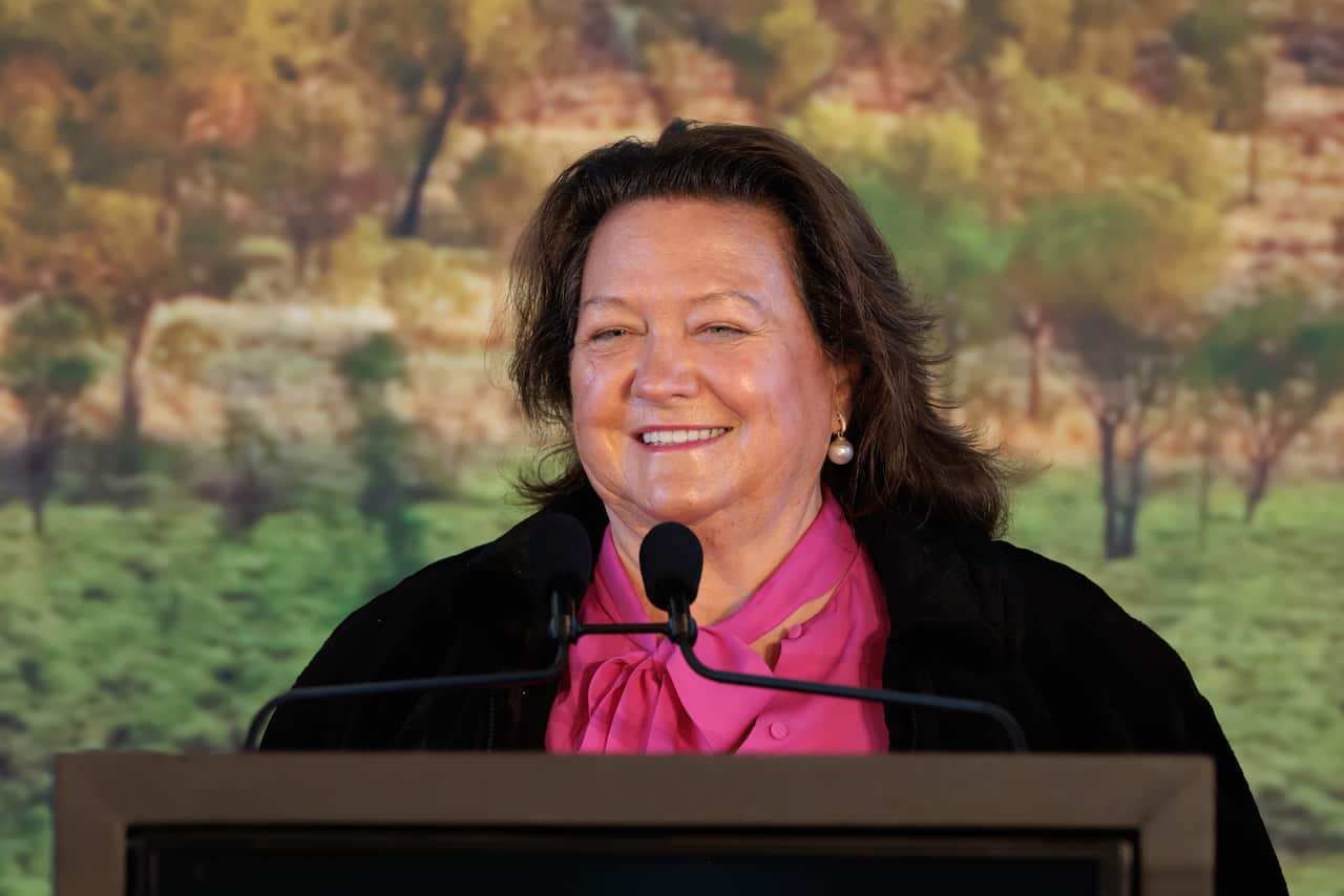 Gina Rinehart speaking at a lecturn 