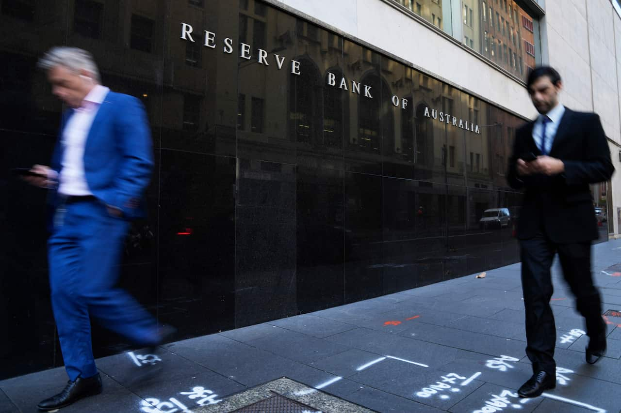 People walk past the outside of the Reserve Bank in Sydney