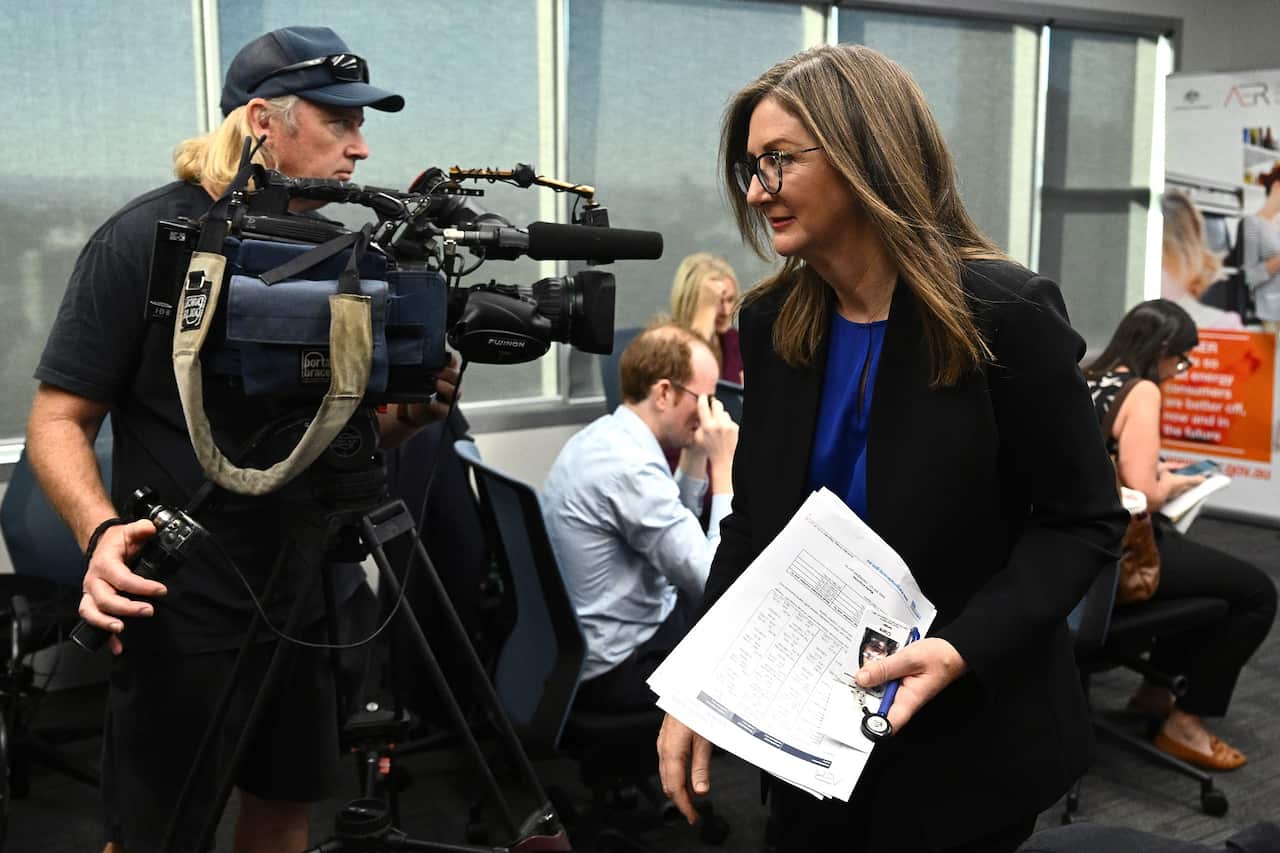 AER chair Clare Savage leaves after releasing its draft determination for the Default Market Offer (AAP)