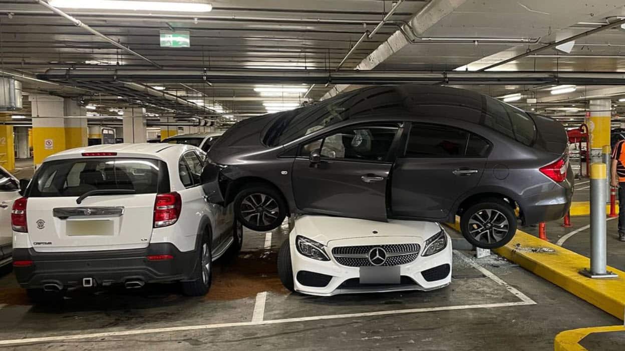 Mercedes squashed by another car in Sydney carpark crash