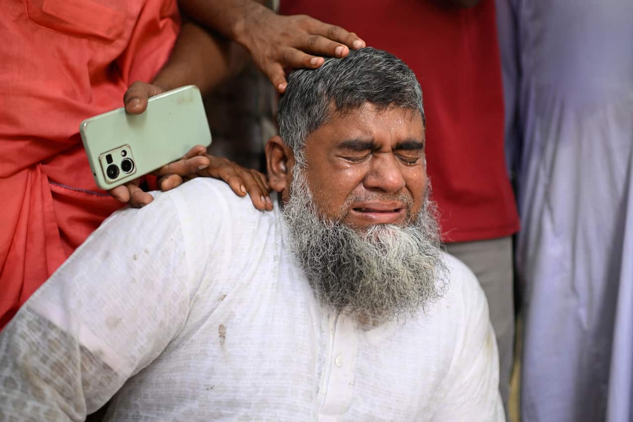 Man wearing white cries 