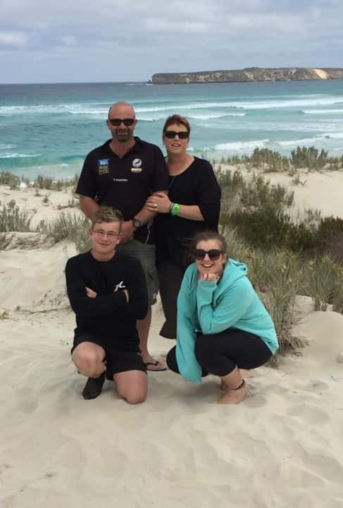 Tash with her family at a beach.