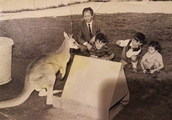 Americo Spinapolice with his children and a young kangaroo.