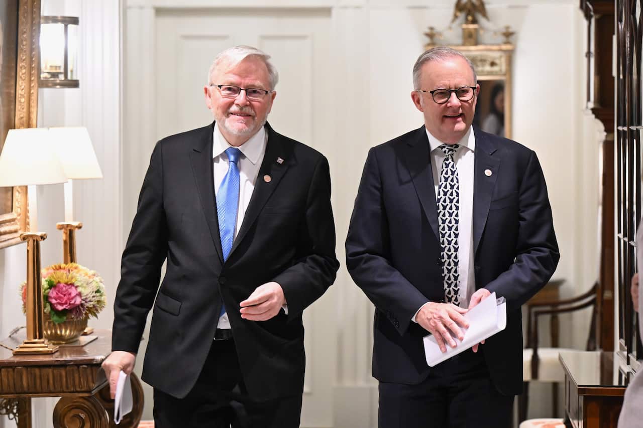 Two men wearing suits and ties