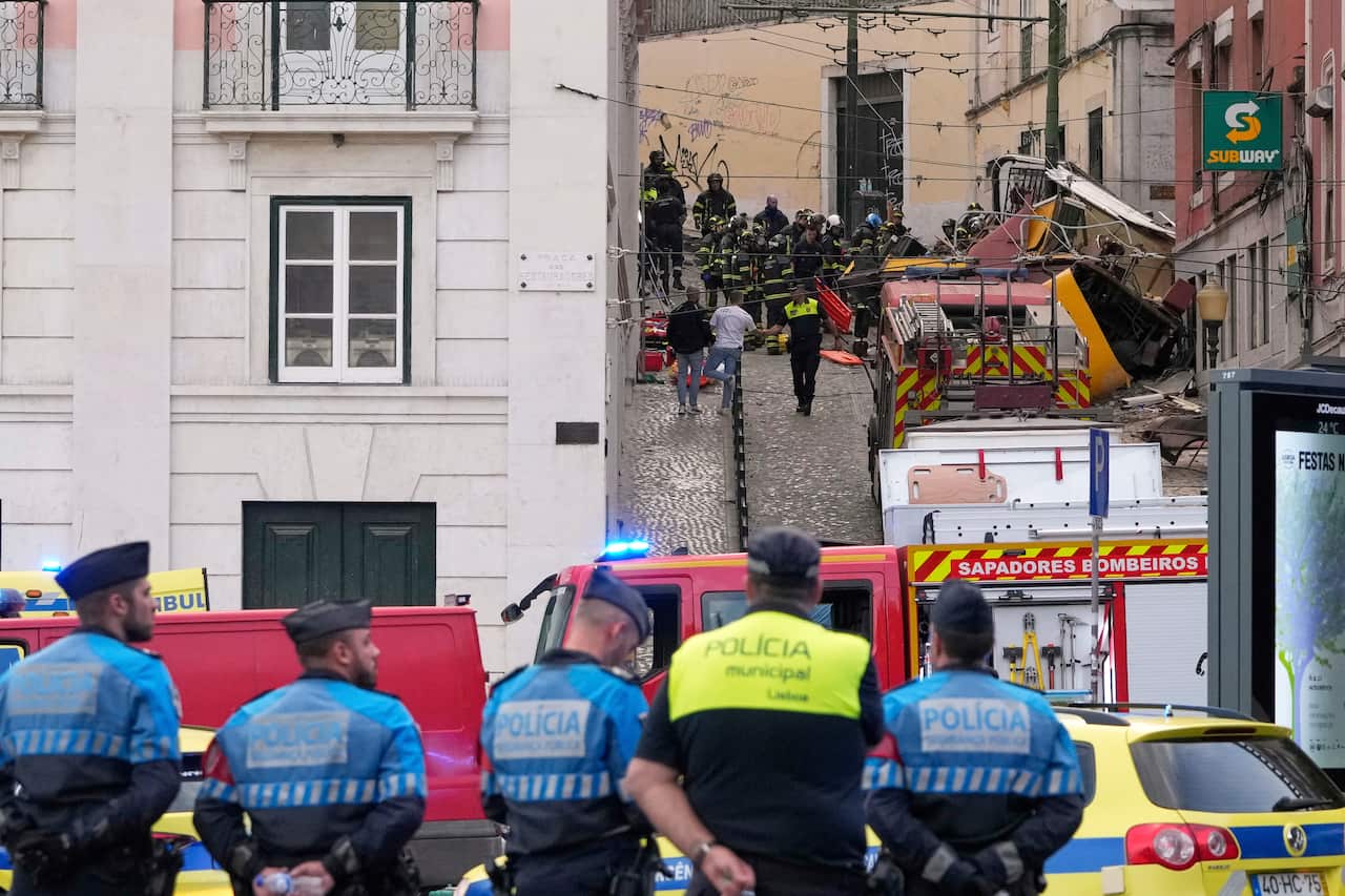 Emergency teams work at the site of a funicular crash.