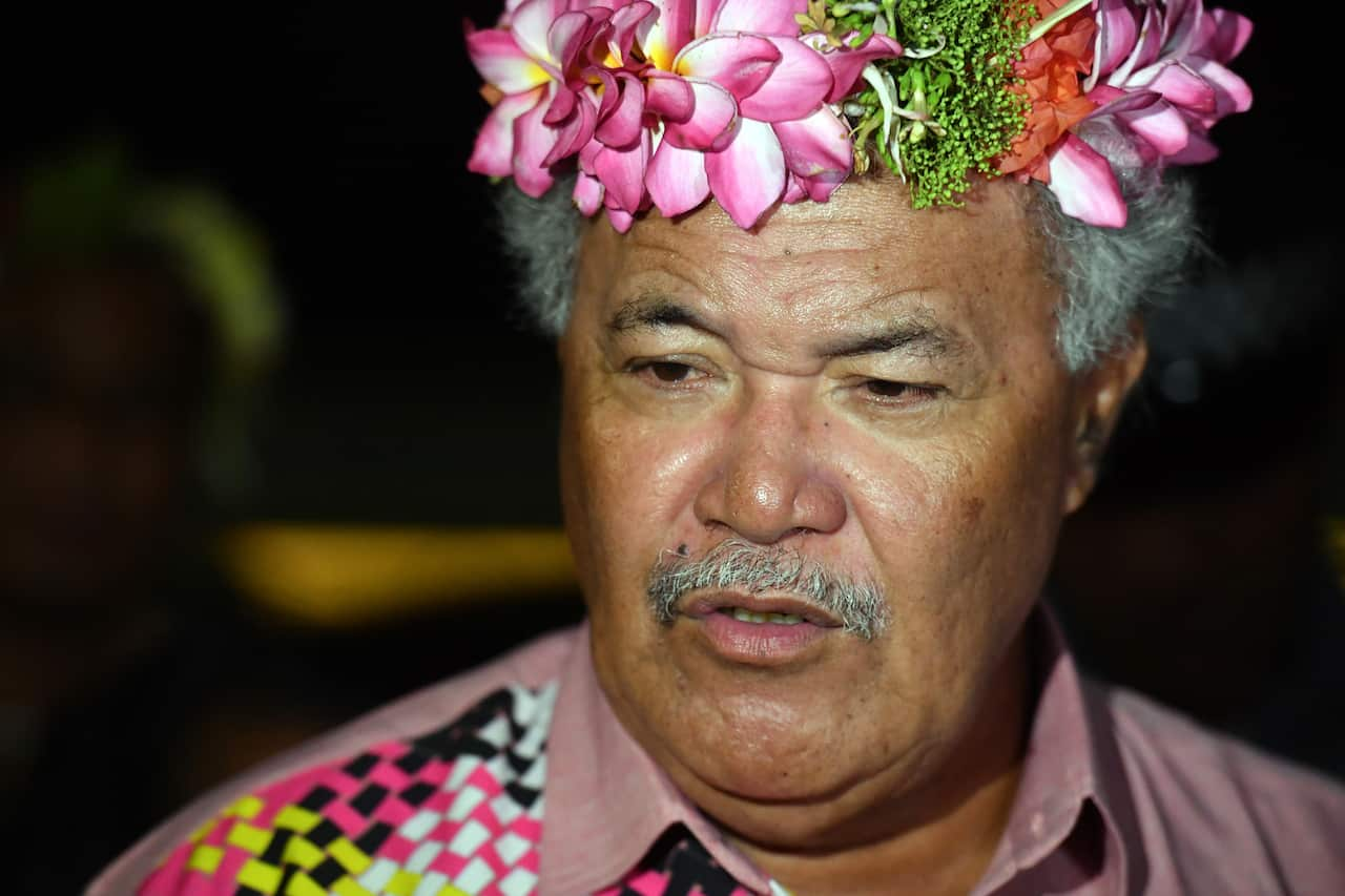 A man wearing a crown of flowers.