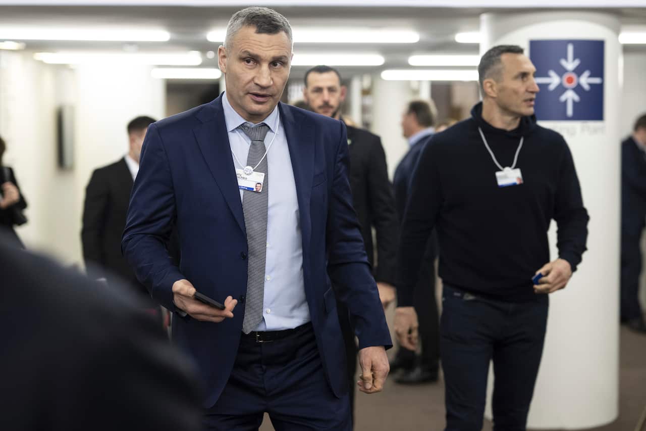 Men walking in suits.