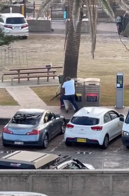 A man wrestles a gunman