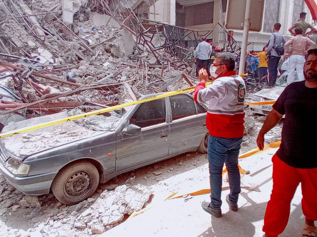 A car under rubble from the collapsed high rise building in Abadan in Iran.