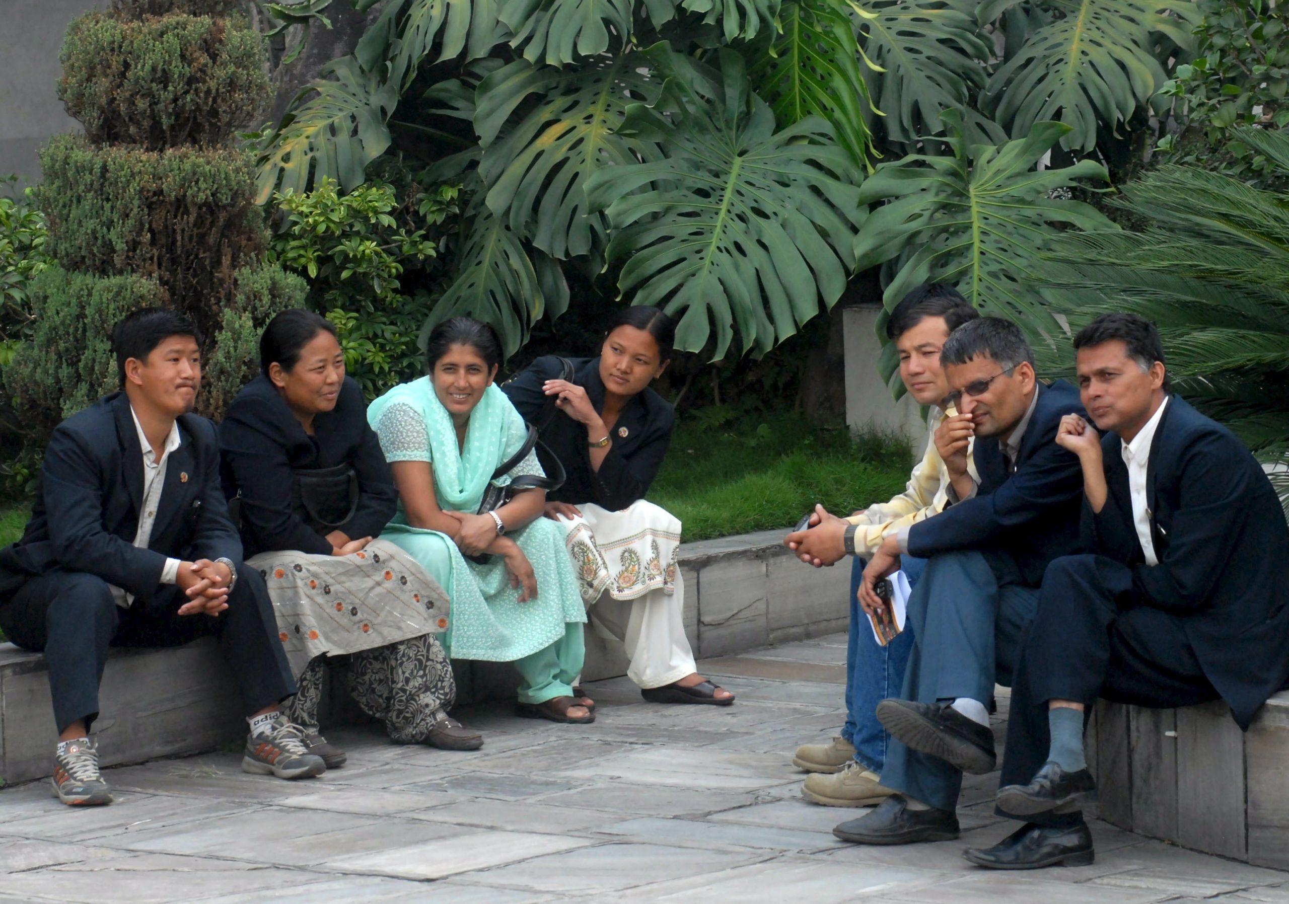 Nepalese Maoist's Constitute Assembly members gather while talking at the Parliament premises l before the session start in Kathmandu, Nepal. 21 May 2009. The formation of a new government is still in limbo as the Maoists parliamentarians have been blocking the parliament session insisting that Nepalese President Ram Baran Yadav's "unconstitutional move" to prevent the army chief's dismissal should be return. The former rebel Maoist leader Pushpa Kamal Dahal also known as Prachanda resigned when the president blocked his decision to sack the chief of Nepalese army earlier this month. The Maoists accused army Chief Rukmangat Katawal of refusing to integrate 19,000 of their PLA fighters into the regular army.  AAP/EPA/NARENDRA SHRESTHA