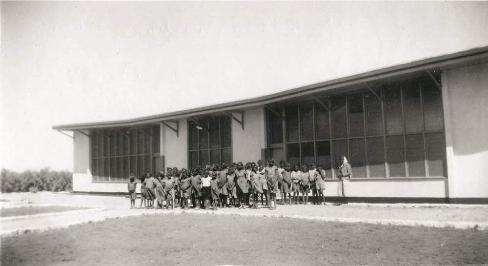 The children lined up at the front of the school, Hermannsburg, NT, 1953. (Image: Lutheran Archives)