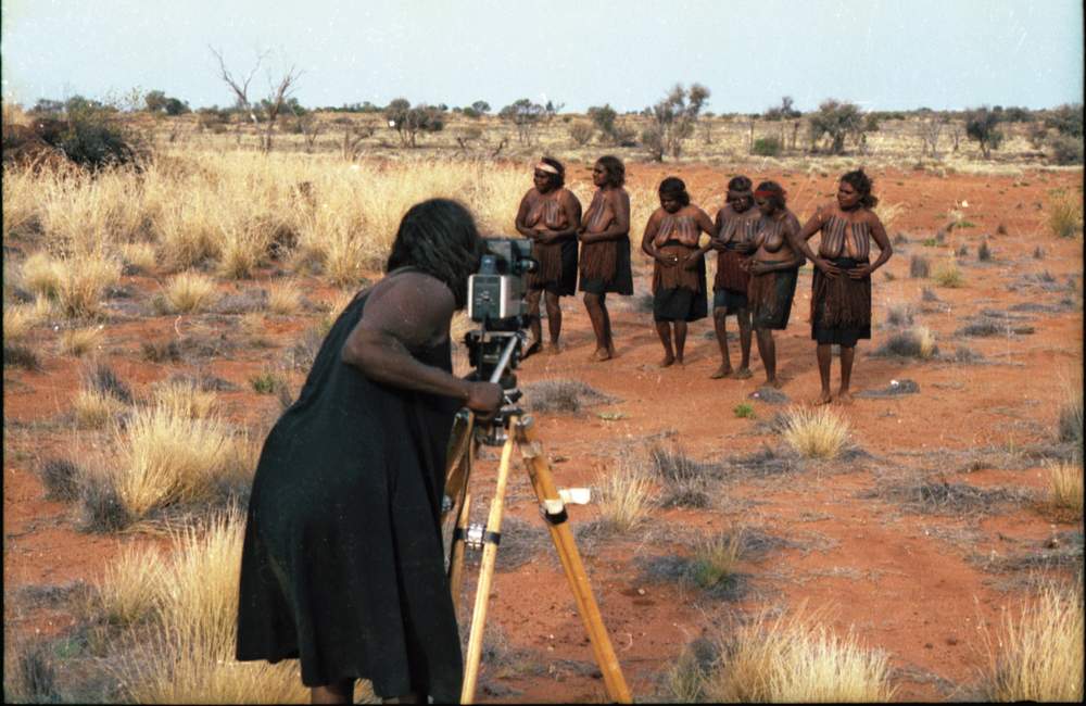 Pantjiti filming the Seven Sisters inma for EVTV, Tjukurpa site. (Image: Guthrie &amp;amp; Irving Collection)