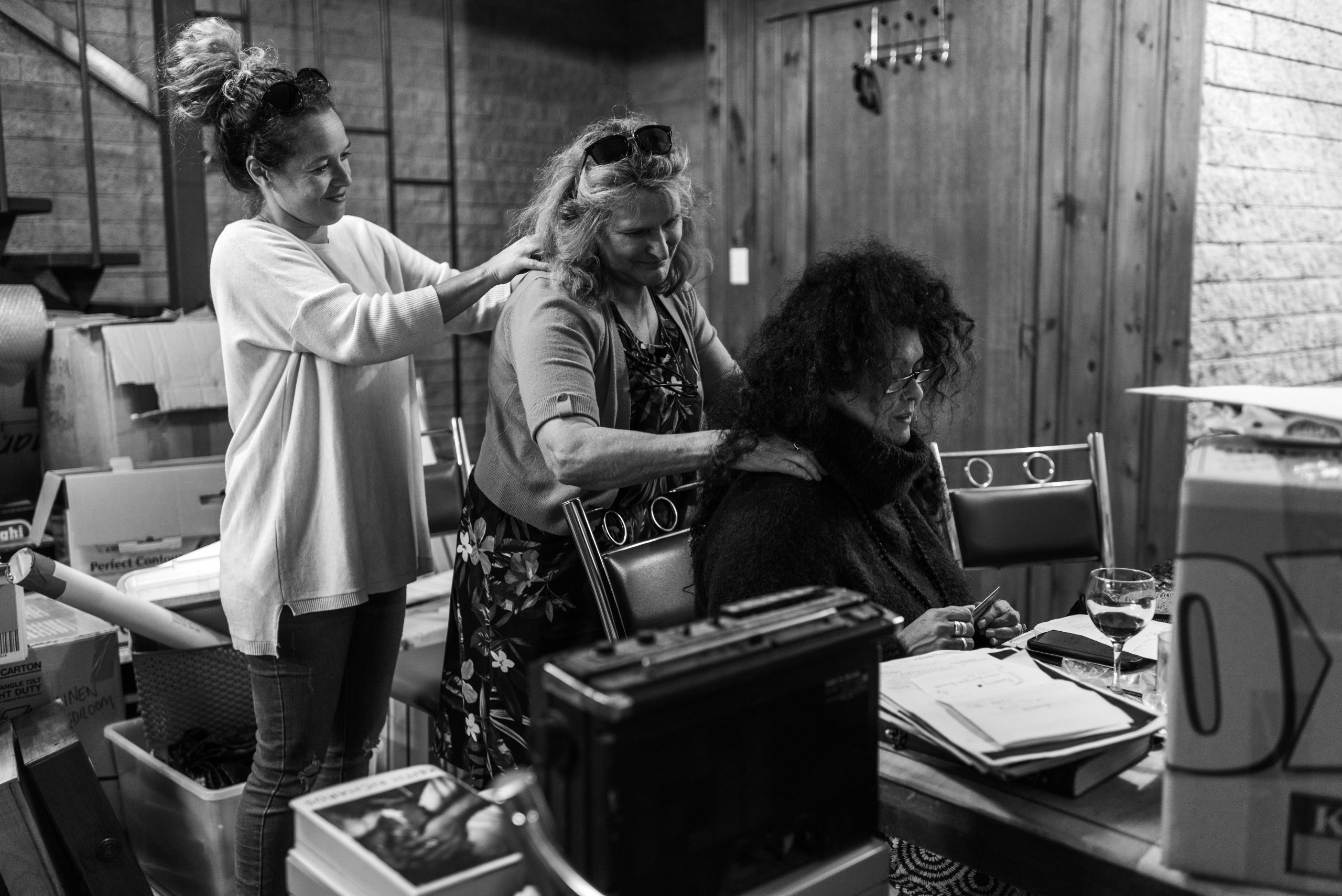Merryn's close friend, Kathryn "Chookie" McKellar gives Merryn a should rub to ease tension in her back. Tamara, Merryn and Glen's daughter, "assists". 17 April 2019. Yuin Country (Central Tilba, NSW).
