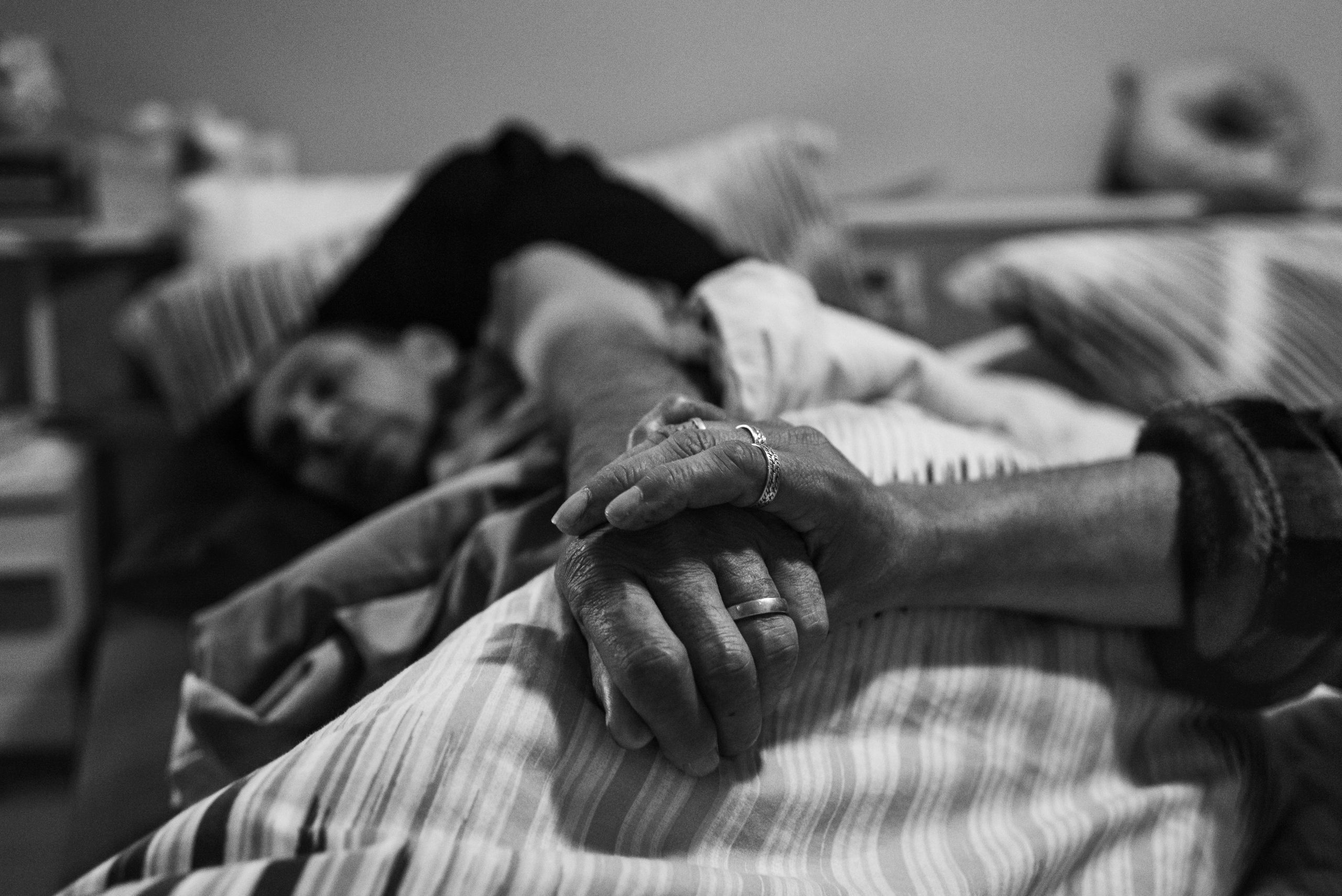 Merryn sits with Glen as morphine causes his pain to subside. 31 January 2019. Yuin Country (Central Tilba, NSW).