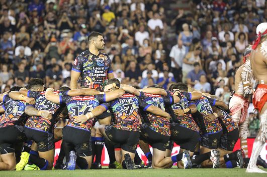 Indigenous All Stars captain Greg Inglis stands tall during the teams’ performance of the war cry ahead of the match against the NRL All Stars in Newcastle, February 2017.