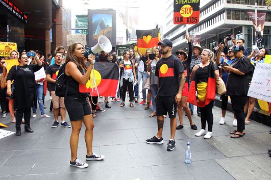 Lynda June Coe & Cameron Manning Brown speaking at a protest outside of Channel 7 headquarters in Martin Place Sydney in 2018.