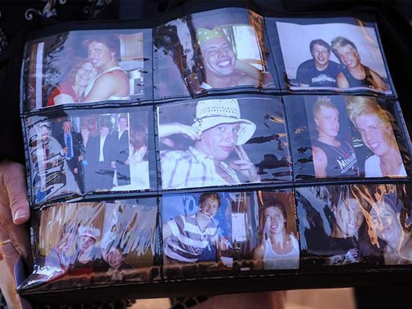 A bag covered in pictures of Matthew Leveson carried by Faye Leveson in October 2009.(AAP Image\/Dean Lewins) A bag covered in pictures of Matthew Leveson carried by Faye Leveson in October 2009.(AAP Image\/Dean Lewins)