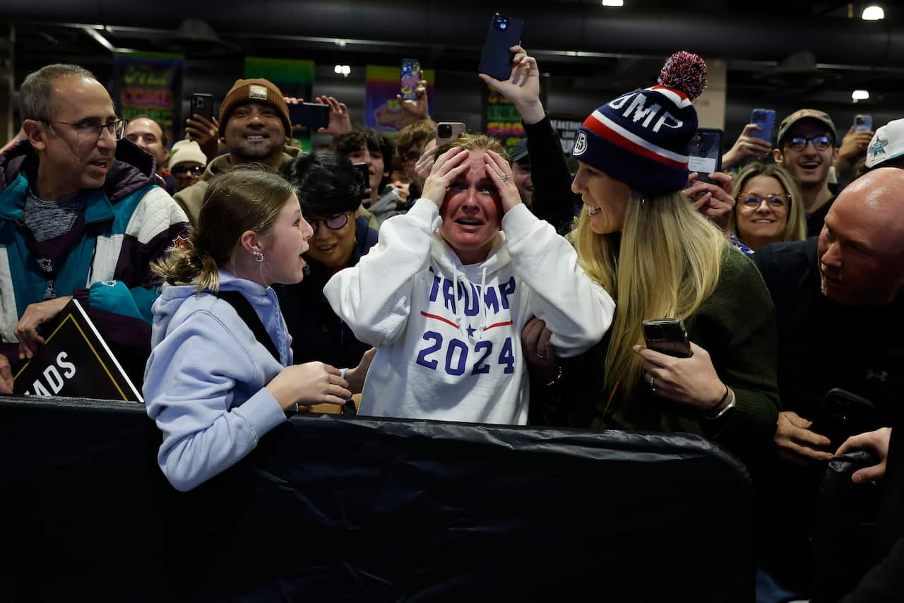 People smiling and cheering.