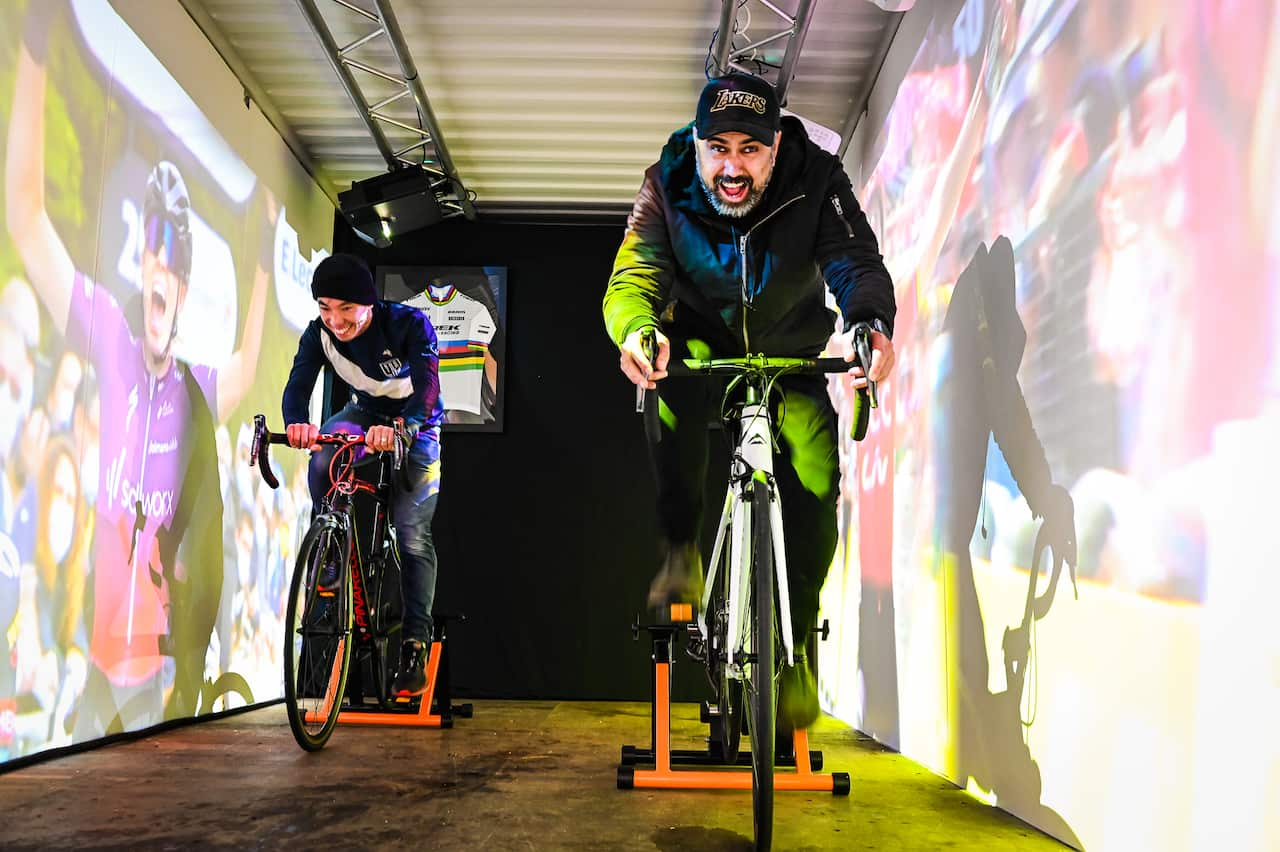 Cycling fans try their luck on the bikes at the Tour de France Femmes pop-up in Sydney