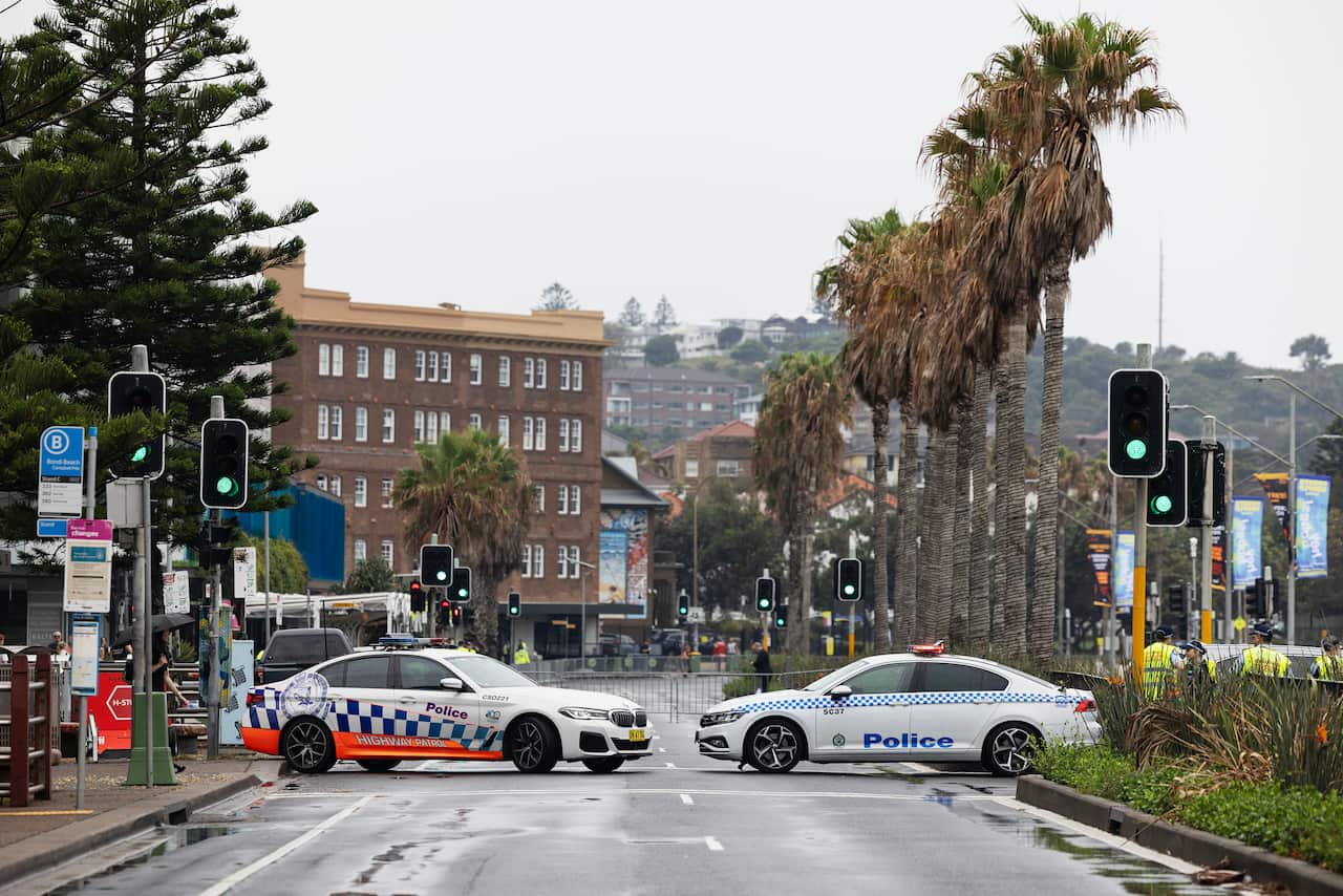 Police cars blocking a road
