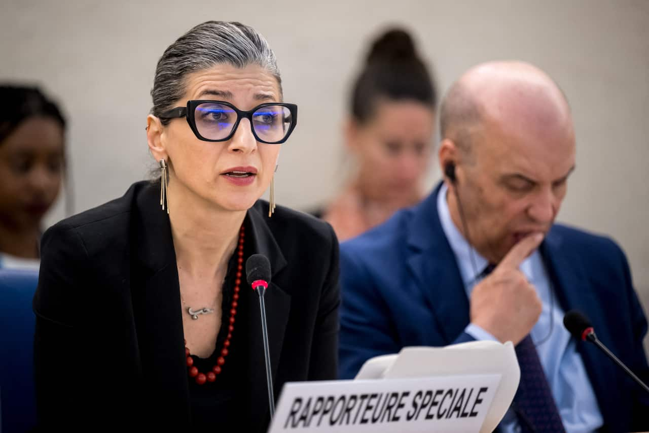 United Nations (UN) Special Rapporteur on the Rights Situation in the Palestinian Territories, Francesca Albanese (L), delivers her rapport next to the president of the UN Human Rights Council Omar Zniber, during a session of the UN Human Rights Council, in Geneva, on March 26, 2024.