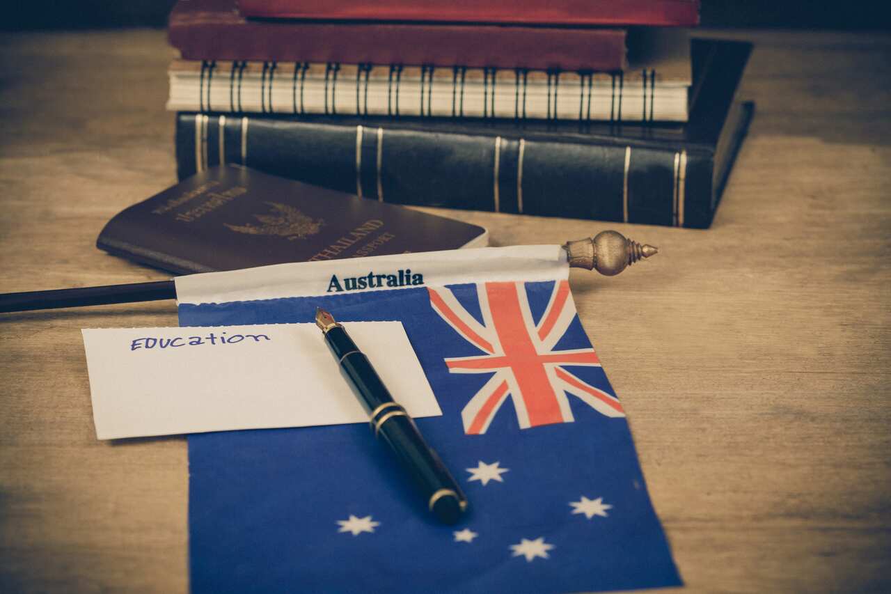 Education in Australia concept,passport and white note on Australia flag .