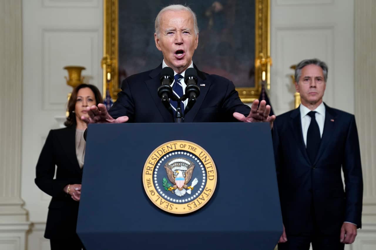 Joe Biden in the foreground with Kamala Harris Antony Blinken in the background.