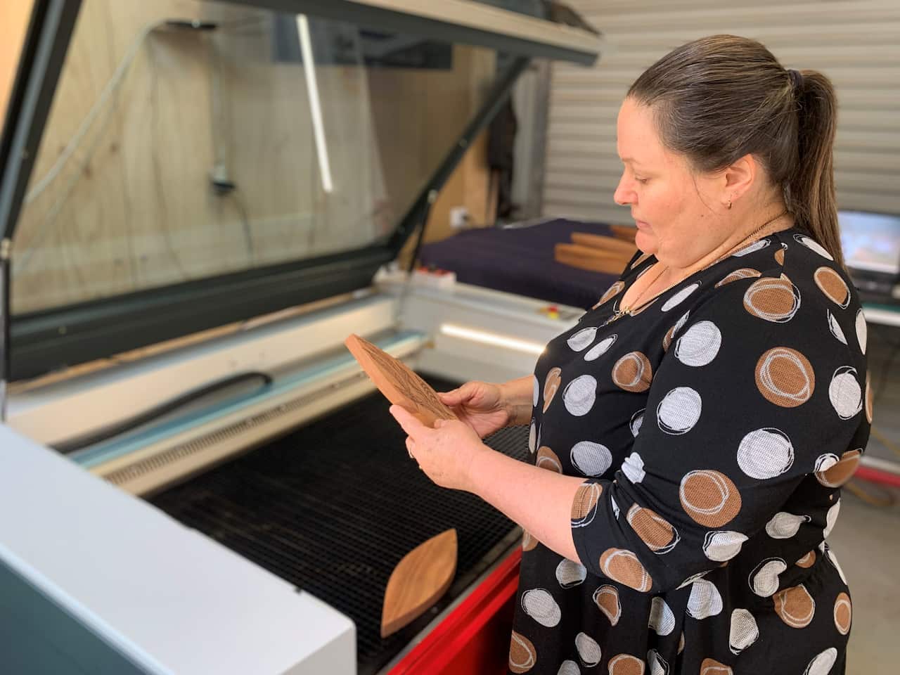 Mick's wife Nicole operates the laser cutter 