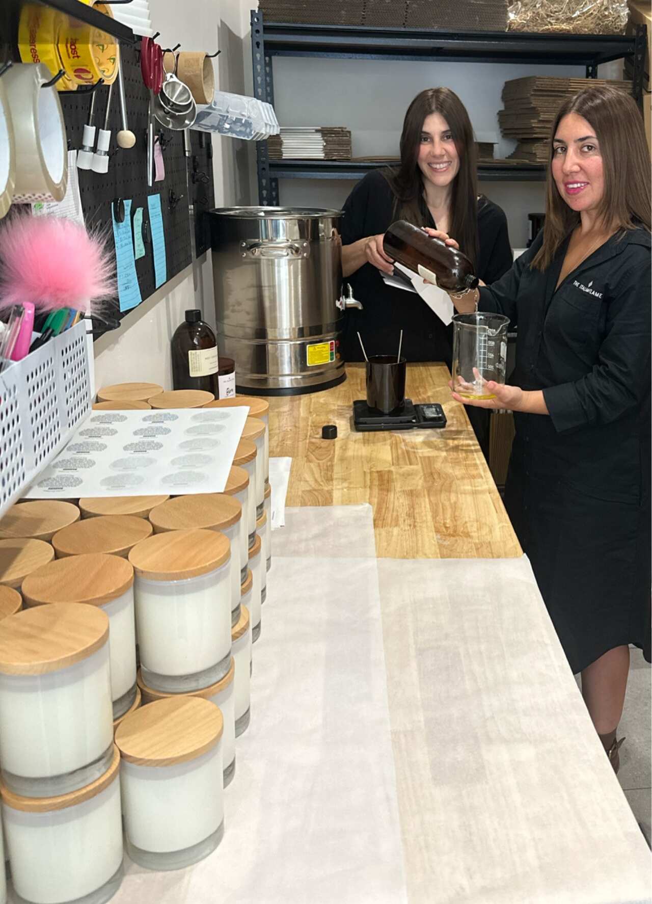 Grace and Marylee Guerrisi in their lab making candles.