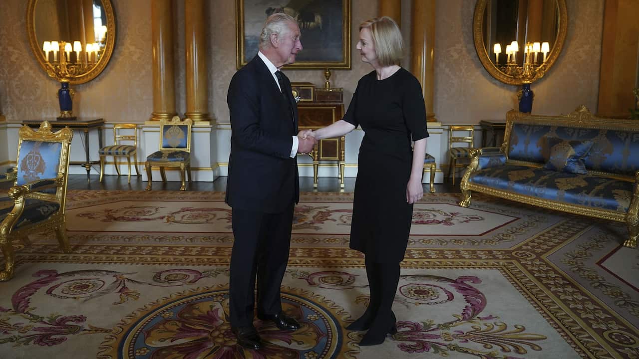 King Charles III shaking hands with prime minister Liz Truss. 