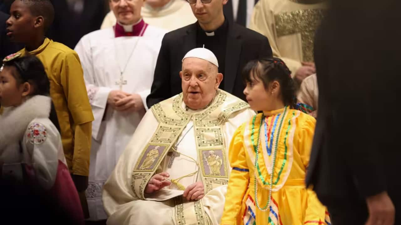 Pope Francis delivers his blessing during the Christmas Eve mass at St Peter's Basilica. (Photo by Marco Iacobucci / SOPA Images/Sipa USA)
