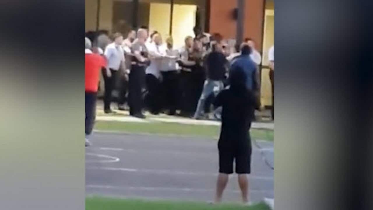 A confrontation between detainees and officers at Villawood detention centre.