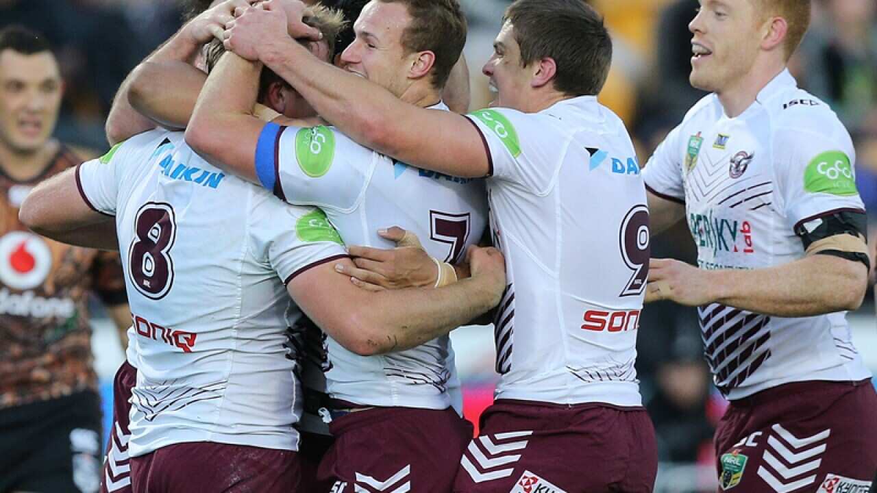 The Sea Eagles celebrate the try of Jake Trbojevic