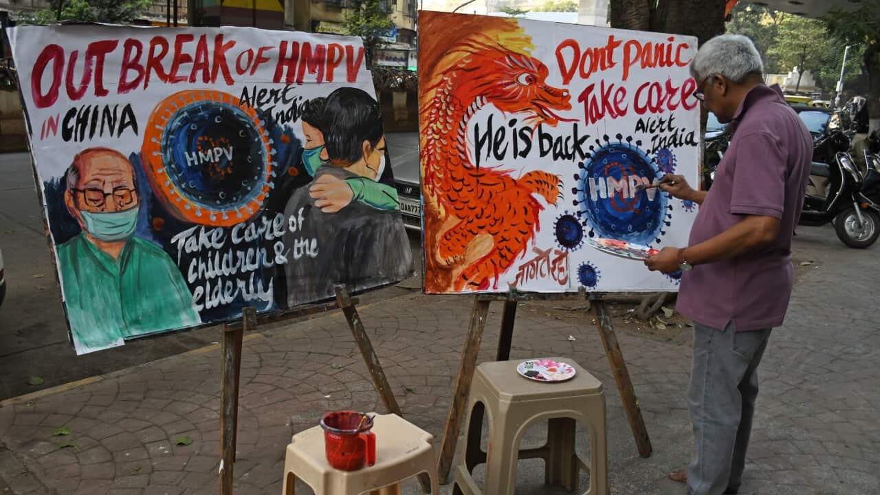 Gurukul school of art paints an awareness poster on Human metapneumovirus (HMPV) in Mumbai, India - 6 Jan 2025