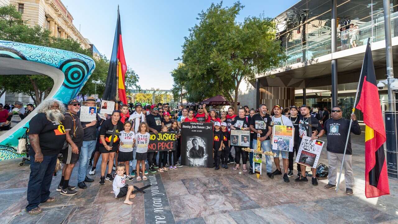 Protesters are seen during a Stop Black Deaths in Custody rally in Perth, Thursday, April 15, 2021. The protests mark the 30th anniversary of the Royal Commission into Aboriginal Deaths in Custody, which handed down its final report on April 15, 1991.