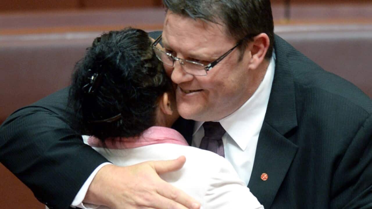 Palmer United Party's Glenn Lazarus (R) and Jacqui Lambie