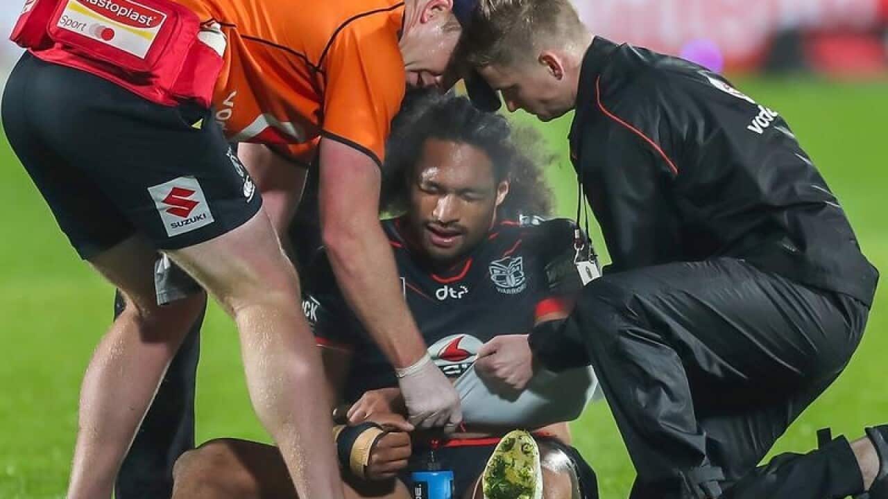 Bunty Afoa of the Warriors receives medical treatment