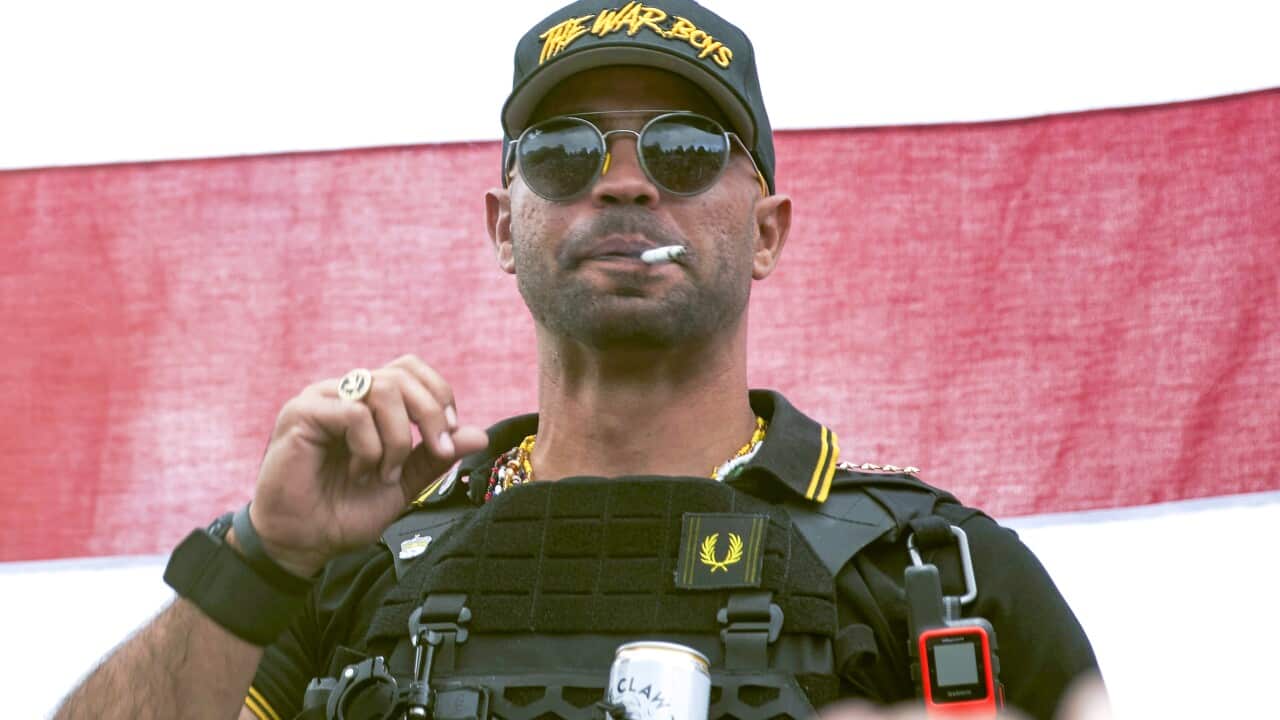 A man smoking a cigarette.