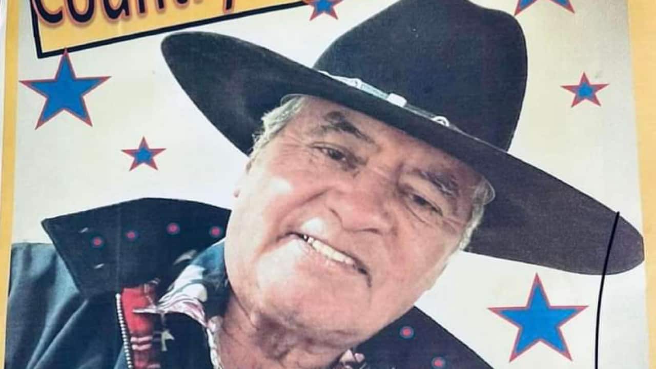 A magazine image of a man in a western hat