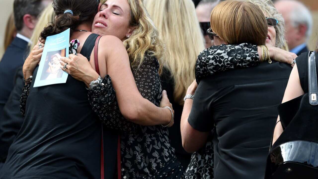 Mourners at the memorial service for Katrina Dawson