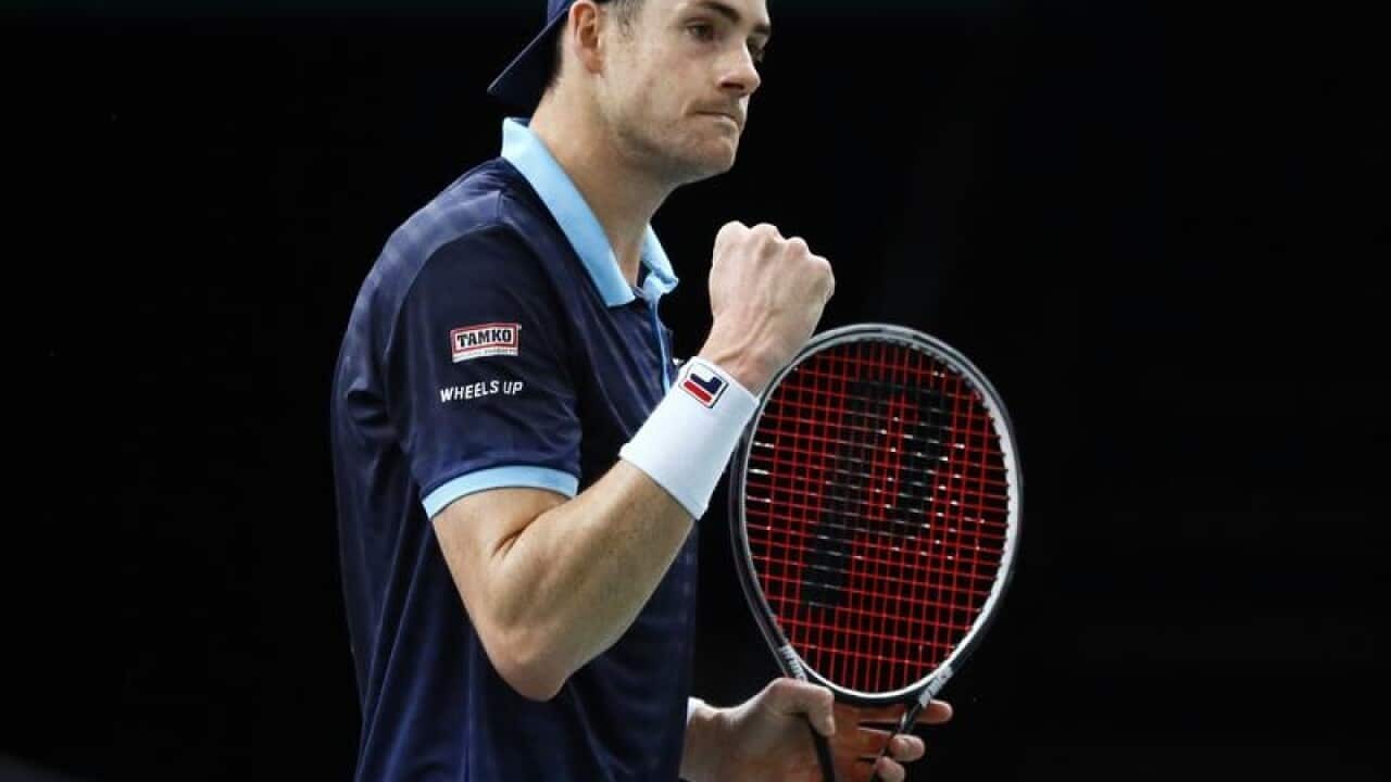 John Isner celebrates his victory over Juan Martin Del Potro