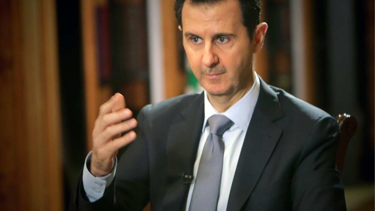 File photo Bashar Assad addressing an audience