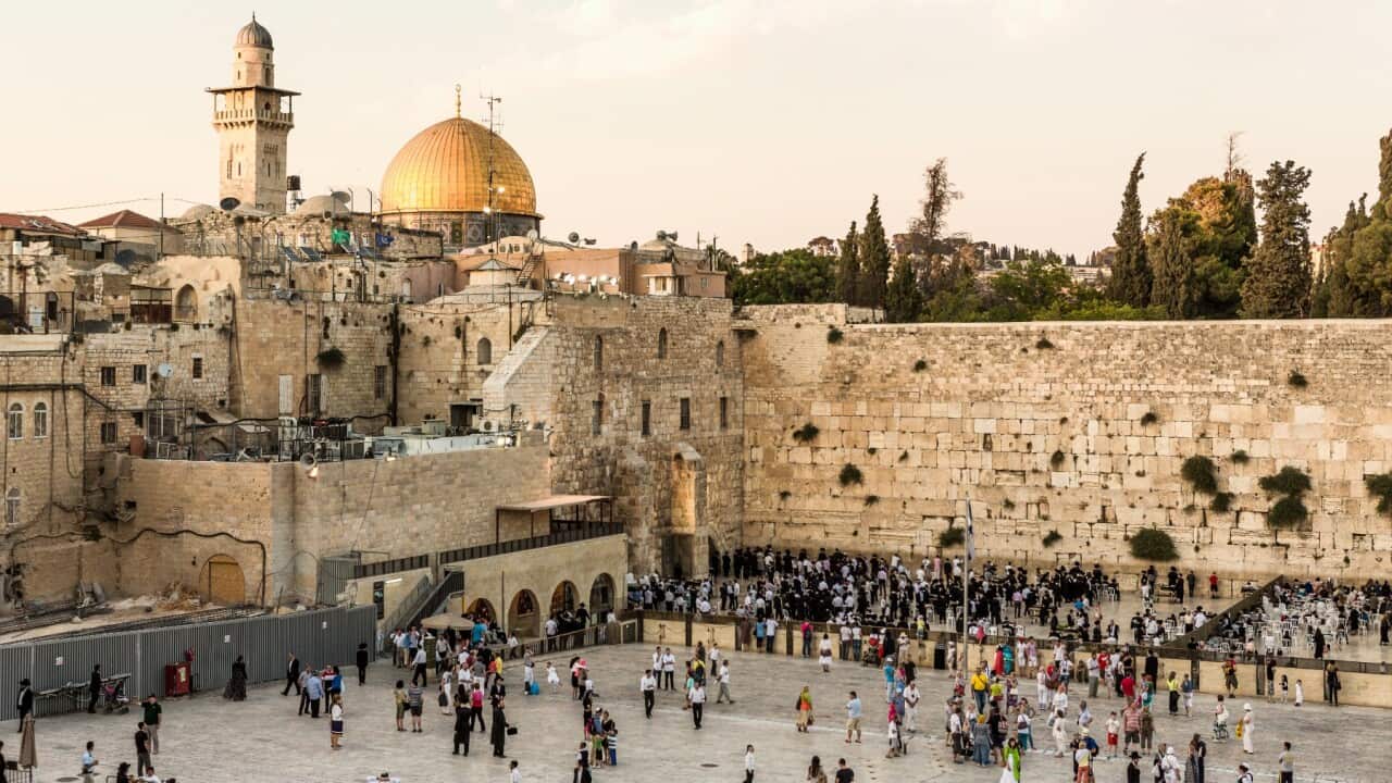 Getty Old Town, Jewish Quarter, the Western Wall (Wailing Wall) and, on the background, the Dome of the Rock and a minaret of Temple Mount Getty ImagesAtlantide Phototravel.jpg