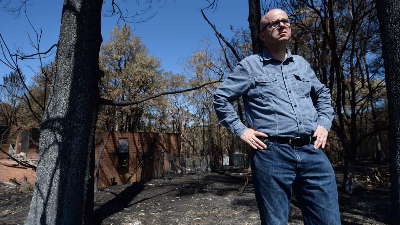 Blue Mountains Mayor Mark Greenhill poses for photographs in fire affected areas in the town of Winmalee in the Blue Mountains, west of Sydney, Wednesday, Oct. 23, 2013. (AAP Image/Lukas Coch) NO ARCHIVING
