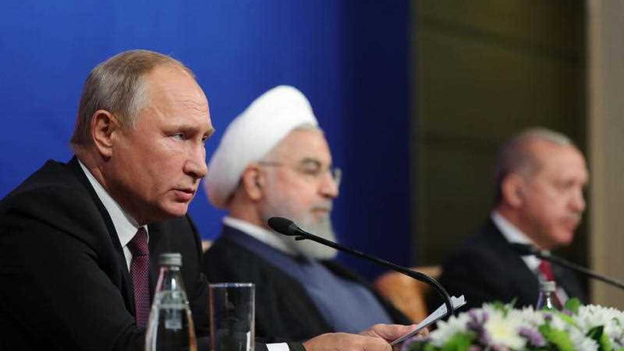 Iranian President Hassan Rouhan (C), Russian President Vladimir Putin (L), and Turkish President Recep Tayyip Erdogan