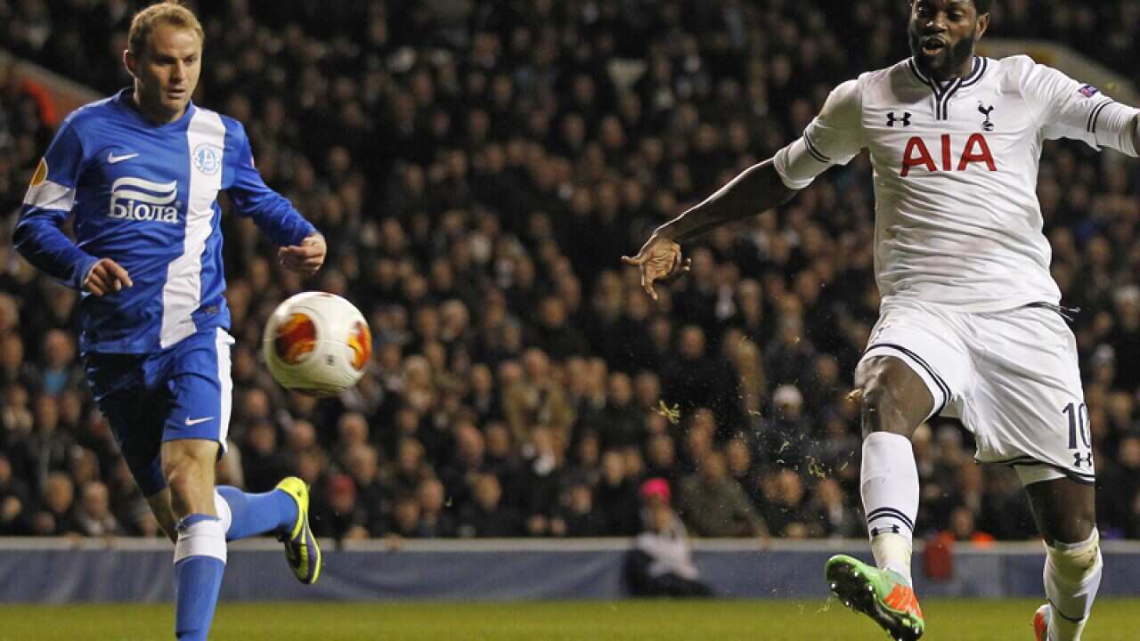 Tottenham's Togolese striker Emmanuel Adebayor (R) scores