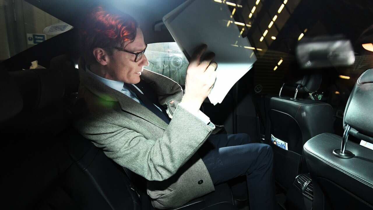 Alexander Nix, CEO of the London-based political consulting firm 'Cambridge Analytica' leaves his offices through the back door in London, Britain, 20 March 2018.
