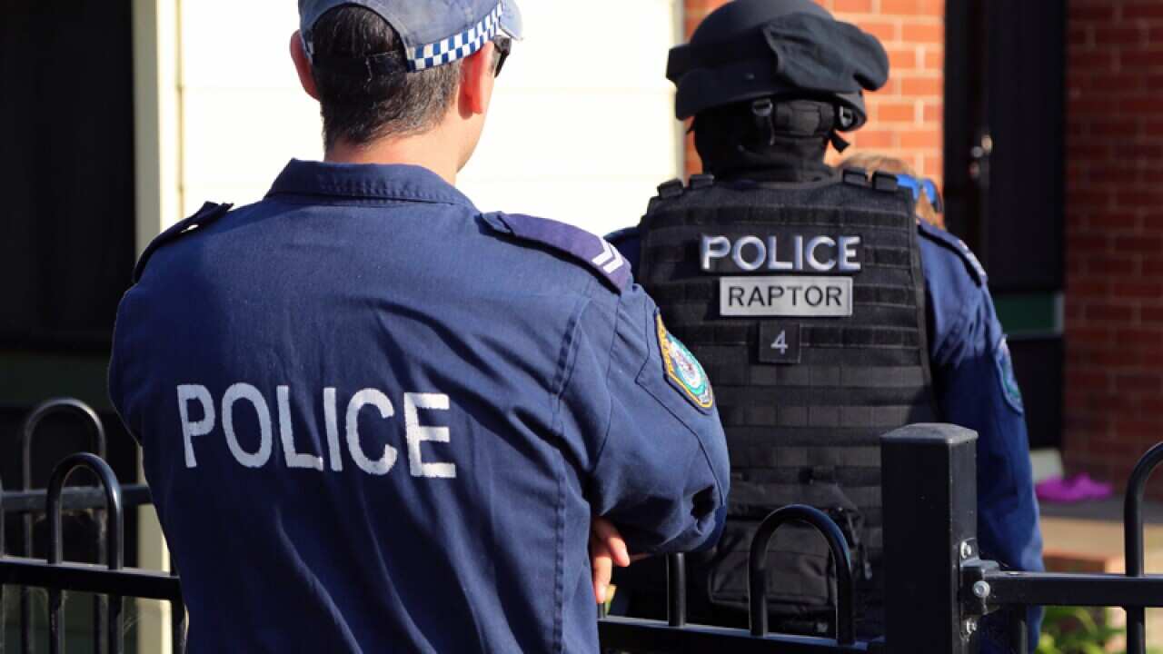 NSW Police performing search warrants.