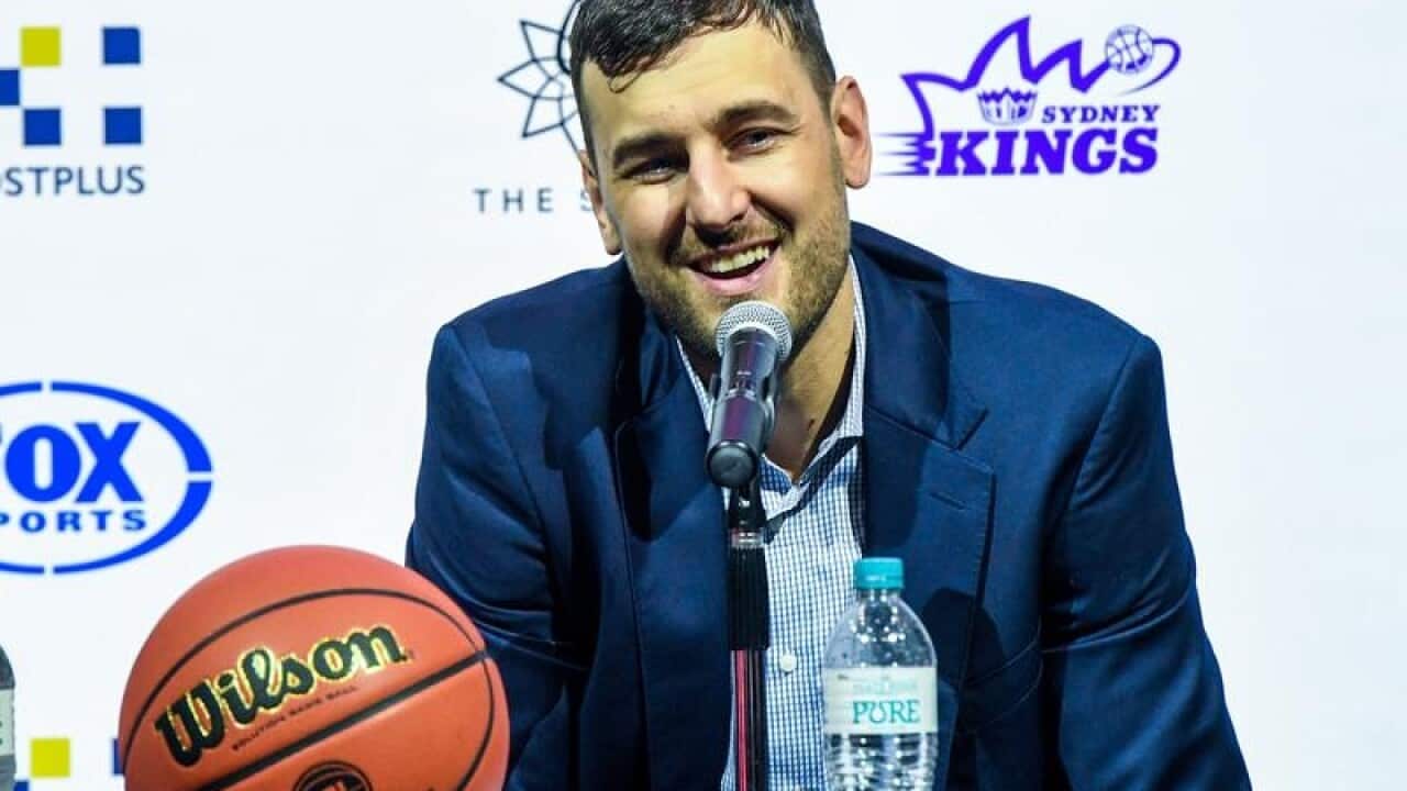 Andrew Bogut talks to media during a press conference in Sydney.